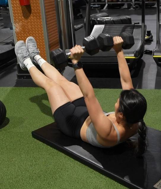 Dumbbell-Press-with-Hollow-Body-Leg-Raises